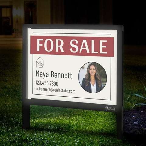 Illuminated Yardsy real estate sign glowing at night - mobile crop